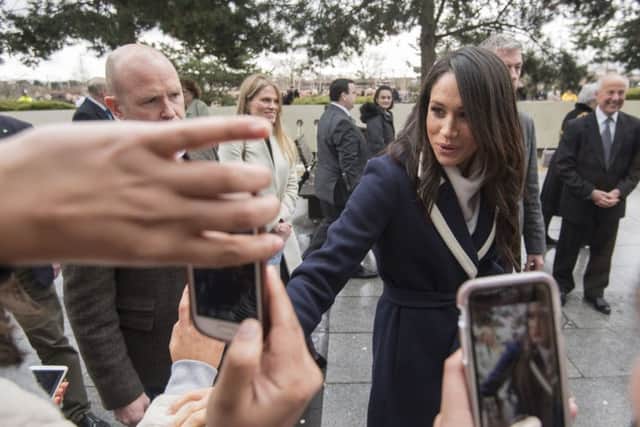 Meghan Markle on a walkabout with Prince Harry during a visit to Millennium Point in Birmingham, as part of the latest leg in the regional tours the couple are undertaking in the run-up to their May wedding