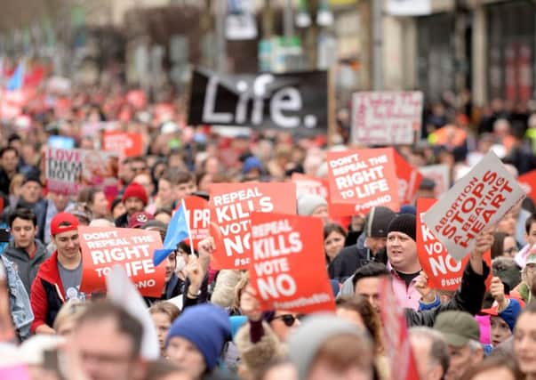 Anti-abortion protesters march through Dublin to campaign for the Eighth Amendment of the constitution to be retained in this summer's referendum on Saturday