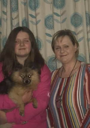 Leah Mallon with her mum Kathryn and pet dog Buddy