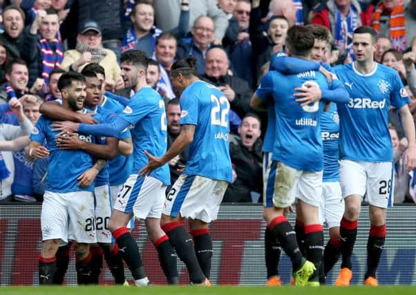 Rangers' Daniel Candeias (left) celebrates scoring but the Ladbrokes Scottish Premiership derby ended in defeat at Ibrox to 10-man Celtic. Pic by PA Sport.