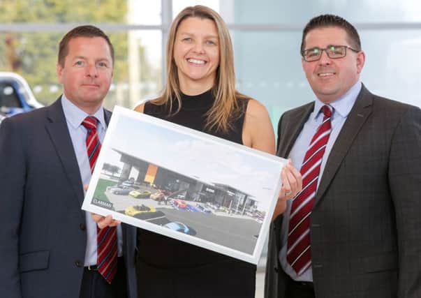 Sales director Richard Ward with finance director Caroline Willis and  Paul Ward, sales director launch the anniversary project for Newry