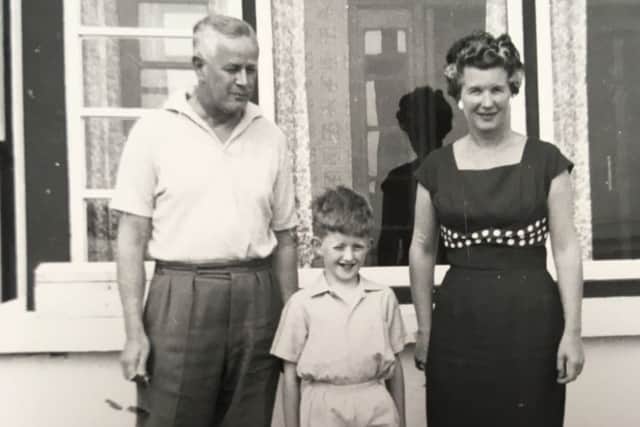 A young Julian with his parents Alan and Pearl
