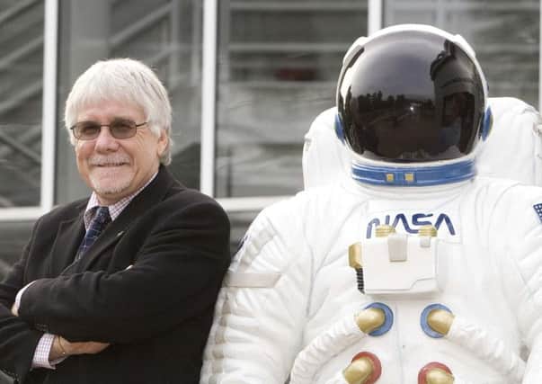 Dr Tom Mason MBE with a figure of a NASA astronaut at the planetarium in 2008