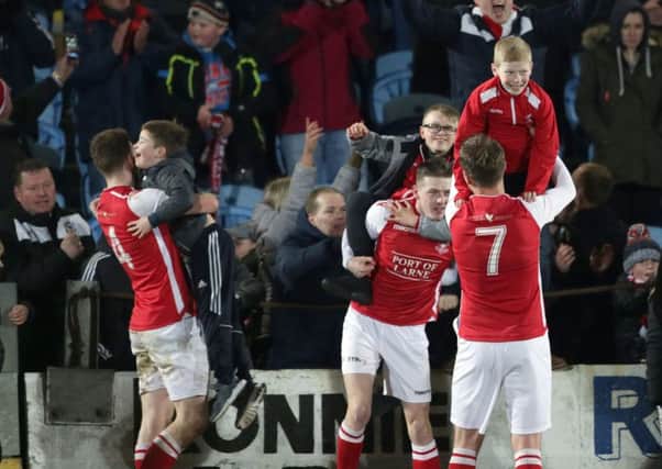 Larne celebrate after beating Ballymena United in the last eight