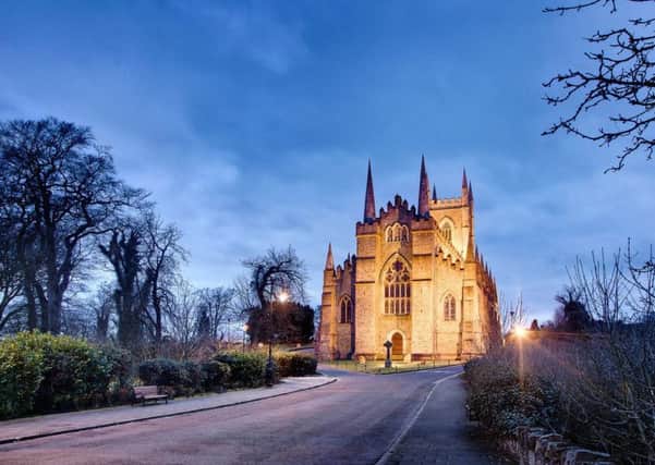 Down Cathedral is a Church of Ireland cathedral. It stands on the site of a Benedictine Monastery, built in 1183. Saint Patrick's remains are buried in the graveyard. Magnificent stain glass windows, box pews and beautiful organ case enhances this interesting building.