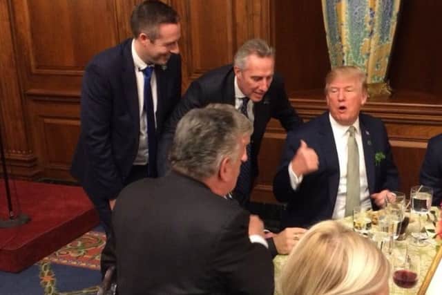 Tweet put out on Paul Givan's Twitter account, 15-03-18 . Mr Givan (left), Ian Paisley, and Donald Trump