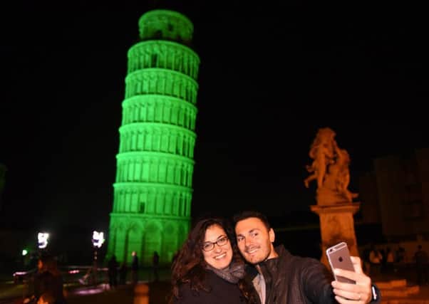 Selfies at the greened Leaning Tower of Pisa, as part of Tourism Irelands annual Global Greening initiative.