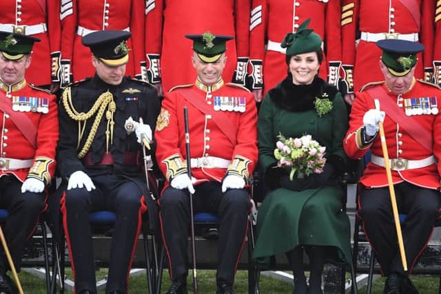 The Duke and Duchess of Cambridge pose for a photograph with officers and guardsmen of 1st Battalion the Irish Guards during the regiment's St Patrick's Day parade at Cavalry Barracks in Hounslow. Picture: Andrew Parsons/Sunday Times/PA Wire
