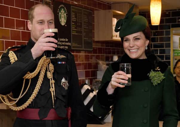 The Duke and Duchess of Cambridge enjoying a drink during the St Patrick's Day parade at Cavalry Barracks in Hounslow. Picture: Andrew Parsons/Sunday Times/PA Wire