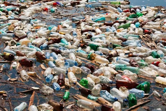 Heavy plastic bottle pollution on water lake