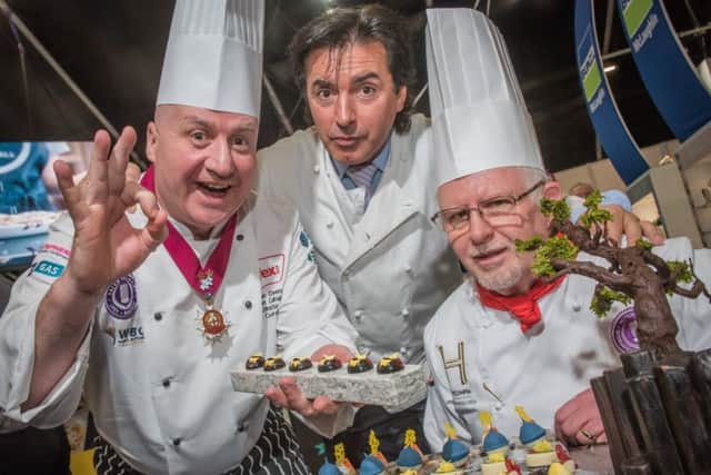 Sean Owens, director of the Salon Culinaire on the opening day of IFEX with Jean Christophe Novelli and edible art judge David Close