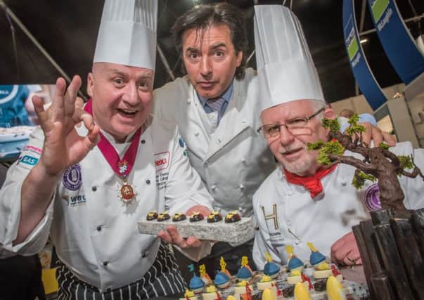 Sean Owens, director of the Salon Culinaire on the opening day of IFEX with Jean Christophe Novelli and edible art judge David Close