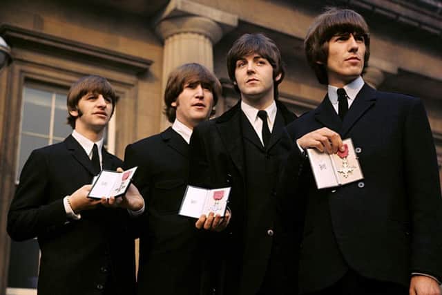 File photo dated 26/10/1965 of (left-right) Ringo Starr, John Lennon, Paul McCartney and George Harrison of The Beatles holding their MBEs, as Ringo Starr will receive a knighthood at an investiture ceremony at Buckingham Palace on Tuesday