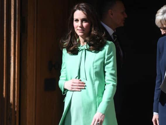 The Duchess of Cambridge leaves after attending symposium of leading academics and charities championing early intervention into the lives of children at the Royal Society of Medicine in London