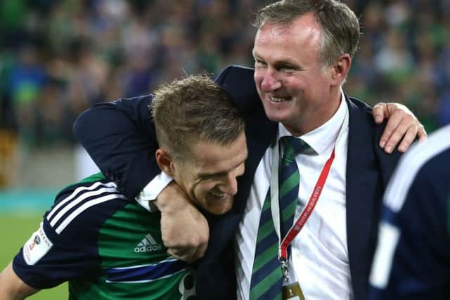 Steven Davis with Northern Ireland manager Michael O'Neill
