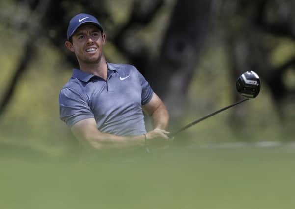 Rory McIlroy watches his drive on the eighth hole during round-robin play at the Dell Technologies Match Play golf tournament