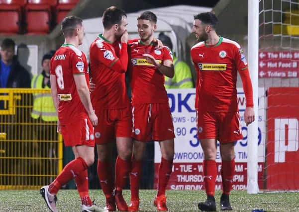 Jay Donnelly bagged a hat-trick as Cliftonville defeated Ards 3-0 at Solitude.