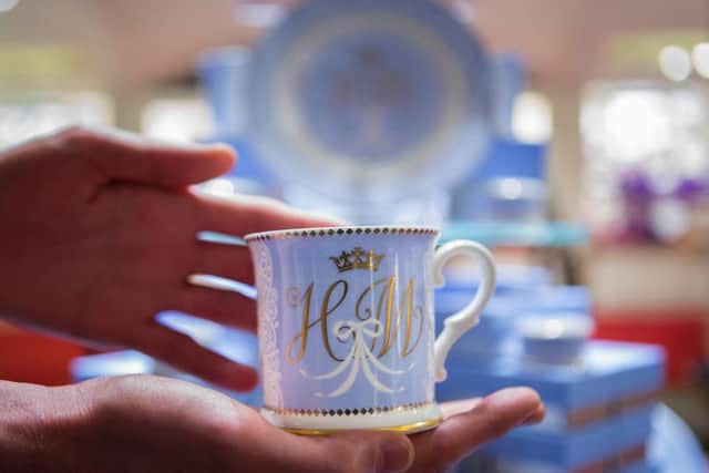 A tea cup bearing the initials H and M which forms part of the new official range of china celebrating the future marriage of Prince Harry and Meghan Markle