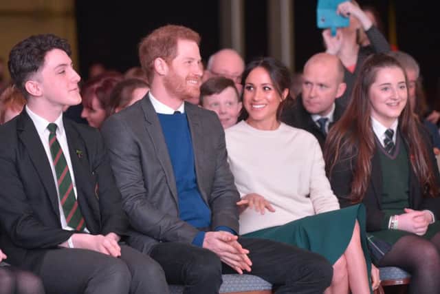 Prince Harry and Ms Meghan Markle take their seats in the front row of the Eikon Centre near Lisburn for the Amazing the Space event. Photo: Aaron McCracken