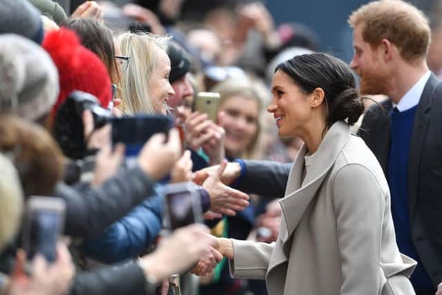 Meghan Markle chats with the crowd on Belfast's Great Victoria Street