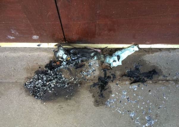 This petrol bomb was thrown at the front door of Glenageeragh Orange hall, near Augher in Co Tyrone on 24 March 2018.