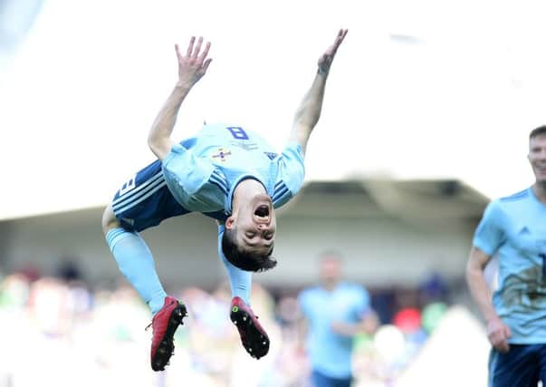 Paul Smyth following his goal for Northern Ireland against South Korea. Pic by Pacemaker.