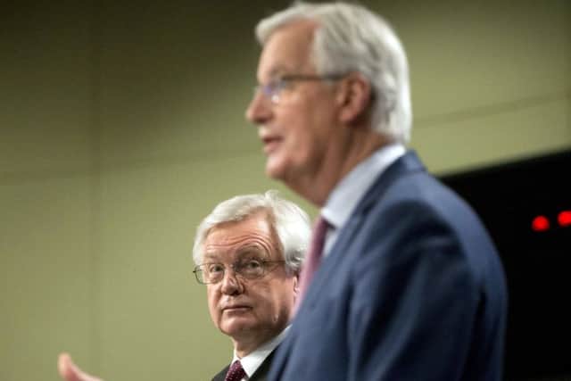 Brexit Secretary David Davis (left0 and European Union chief Brexit negotiator Michel Barnier at last week's press conference announcing the draft text