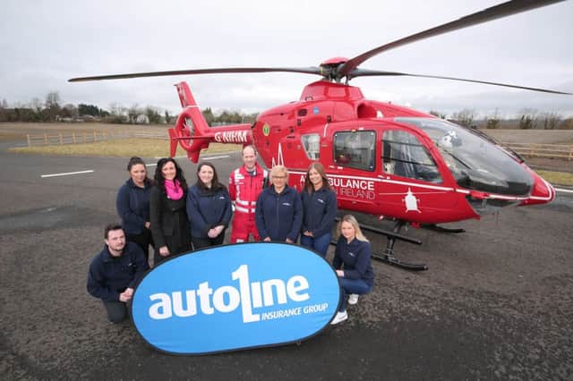 Autoline staff with representatives of the NI Air Ambulance