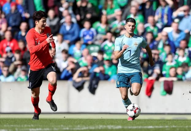 Northern Ireland's Jordan Jones with Korea Republic's Ki Sungyueng during Saturday afternoons International Friendly at the National Stadium at Windsor Park, Belfast.