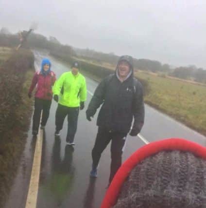 Some of the team from Fitness Factory in Lurgan in training for the Walk the Lough challenge. David Harvey, who is quoted in the article, is pictured in the black jacket.