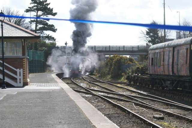 "Enshrouded with plumes of white, steamy smoke" Engine No 131 approaches the blue tape at Saturdays launch