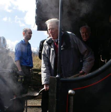 Norman Brown with coal shovel and Arthur Darragh, back right, in Engine No 131 with fireman Andrew Davidson