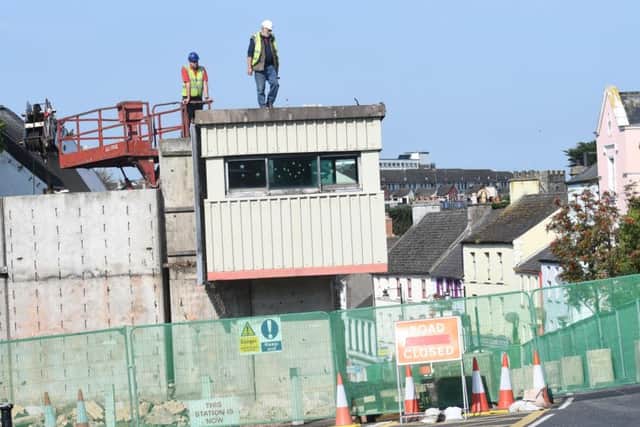 Demolition works  begins to remove the blast wall and sangar from the former PSNI station in Irish Street, Downpatrick, on September 14, 2016.  Whilst the official opening of a new station took place in the town the same year, many villages and towns have seen their stations vanish without being replaced.
