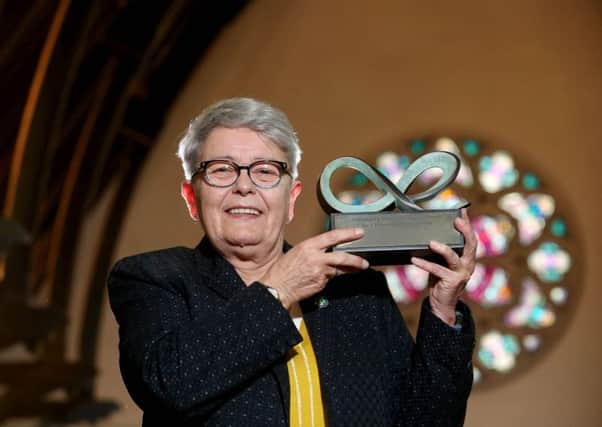 Eileen Weir, the recipient of the 2018 Community Relations Council Exceptional Achievement Award, pictured accepting her award at The Duncairn Centre.