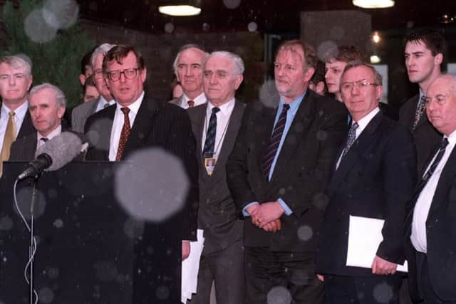 The snow starts to fall as Ulster Unionist party leader David Trimble, backed by party colleagues, announces to the gathered media that the Good Friday Agreement has been reached