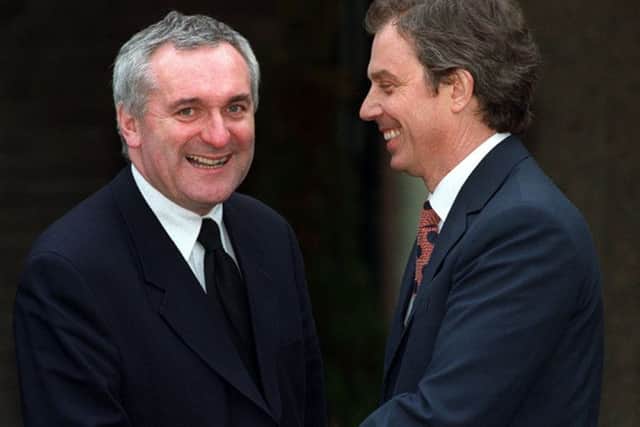 Prime Minister Tony Blair and his Irish counterpart Bertie Ahern shake hands after the Belfast Agreement. Picture Paul Faith/Pacemaker