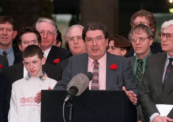 The SDLP party leader John Hume and his talks team emerge from Castle Buildings to give their take on the signing of the Belfast Agreement on Good Friday. Picture by Pacemaker