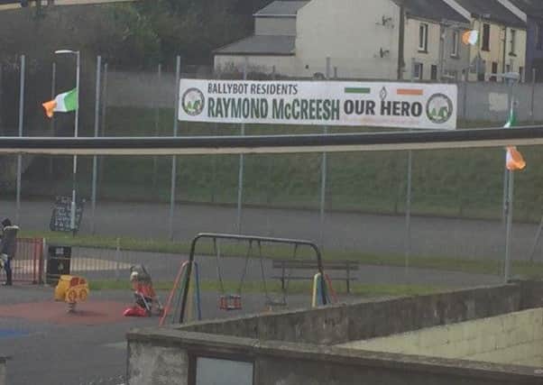 The banner and tricolours erected at the play park in Newry