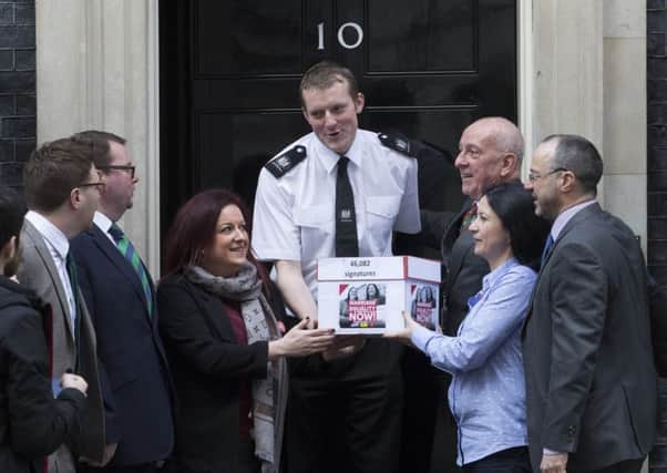 Partners Amanda McGurk (centre left) and Cara McCann (centre right) with Labour MP Conor McGinn (left) outside 10 Downing Street in London, as they deliver a petition of 46,082 signatures calling for same-sex marriage to be extended to Northern Ireland. PRESS ASSOCIATION Photo. Picture date: Wednesday March 28, 2018. The ban on same sex marriage is one of the disputes at the heart of the powersharing impasse in Belfast, with the Democratic Unionists resisting Sinn Fein calls for a law change. See PA story ULSTER Marriage. Photo credit should read: Rick Findler/PA Wire