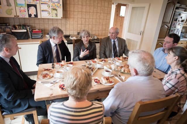 Prime Minister Theresa May having lunch with farmers at Fairview Farm in Bangor, Northern Ireland during a tour of the four nations of the UK, with a promise to keep the country united one year before Brexit. PRESS ASSOCIATION Photo. Picture date: Thursday March 29, 2018. See PA story POLITICS Brexit. Photo credit should read: Stefan Rousseau/PA Wire