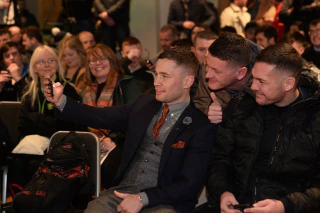 Carl Frampton gets a selfie with a fan as Carl Frampton MBE and Nonito Donaire meet face-to-face at a press conference ahead of their blockbuster showdown at the SSE Arena Belfast on April 21. 
Photo Colm Lenaghan/Pacemaker Press