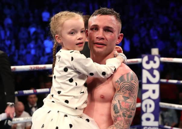 Carl Frampton with his daughter after defeating Horacio Garcia in a Featherweight Contest at the SSE Arena, Belfast. Photo by William Cherry/Presseye