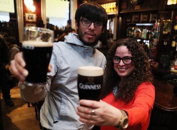 Students Juan Pizarro (left), from Chile, and Yadira Perez, from Mexico, enjoying a drink in Slattery's Bar on Capel street in Dublin as legislation was passed earlier this year to allow pubs to serve alcohol. PRESS ASSOCIATION Photo. Picture date: Friday March 30, 2018. See PA story IRISH Pubs. Photo credit should read: Brian Lawless/PA Wire