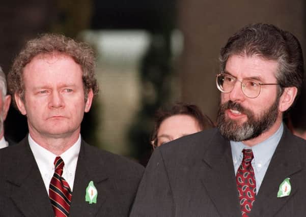 Sinn Fein leaders Gerry Adams and Martin McGuinness emerge from talks to talk to the media on the signing of the Belfast Agreement on Good Friday. Picture Pacemaker
