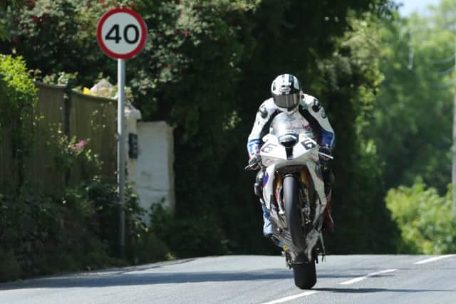 Michael Dunlop on the BMW Motorrad Superbike at the Isle of Man TT in 2014.