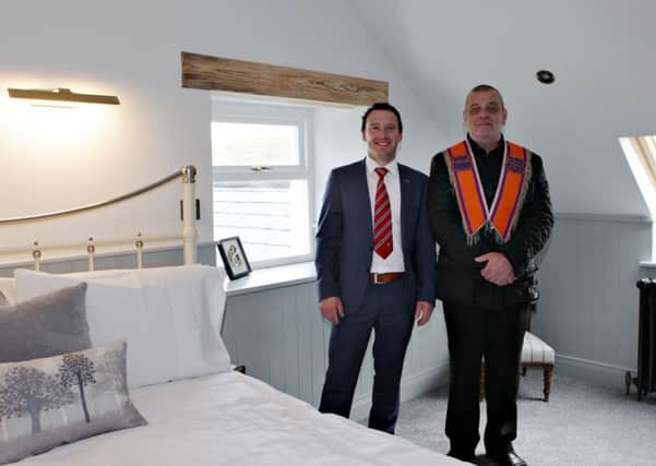 In the accommodation section at the opening of the refurbished 'Old School' at Ballintoy which is part holiday home part Lodge LOL 803 are Stuart Moore and Wesley Craig