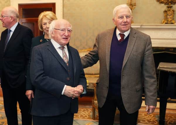 President Michael D Higgins (left) with Johnny Joyce, a descendent of Connemara victims of the Maamtrasna murder case, following the signing of a warrant at Aras an Uachtarain, Dublin, granting a posthumous pardon for Myles Joyce in respect of his conviction for the notorious 1882 Maamtrasna murder case. PRESS ASSOCIATION Photo. Picture date: Wednesday April 4, 2018. See PA story IRISH Pardon. Photo credit should read: Brian Lawless/PA Wire