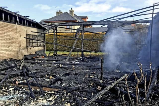 Alan Lewis- PhotopressBelfast.co.uk      8-4-2018
A St Michael's schoolbuilding appears to have been deliberately set on fire last night and at one stage thretened a substantial private property just feet away from the blaze in the grounds of the former St Ronan's College in Lurgan, County Armagh. 
Demolition experts today visited the scene to make sure the fire damaged building was safe.   The fire was still smouldering this afternoon,