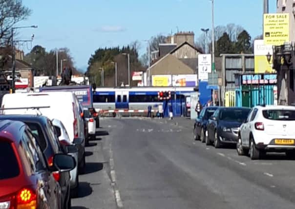 Queues of traffic at the railway gates in Lurgan's William St are a regular occurrence