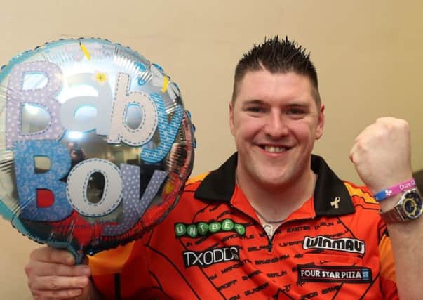 Daryl Gurney celebrates becoming a father for the first time. Pic by PDC